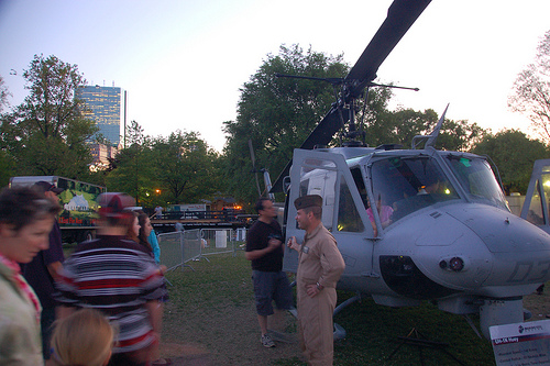 Marine Week Boston, 2010: Bell UH-1N Huey helicopter getting viewed by civilians & soldiers at dusk